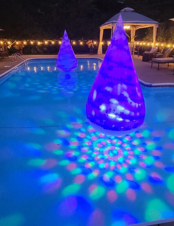 Two blue floating party trees in a swimming pool