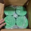 Four green colored boxes inside a carton